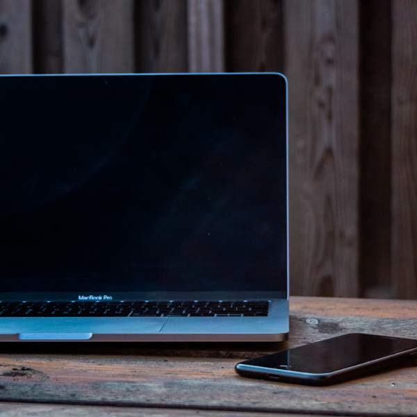 Laptop and Phone on Timber Table