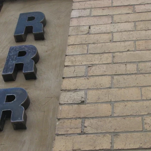 Generic metal RRR sign front door
