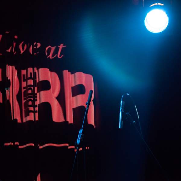 Station generic logo on curtains in performance space