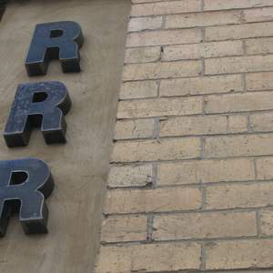 Generic metal RRR sign front door